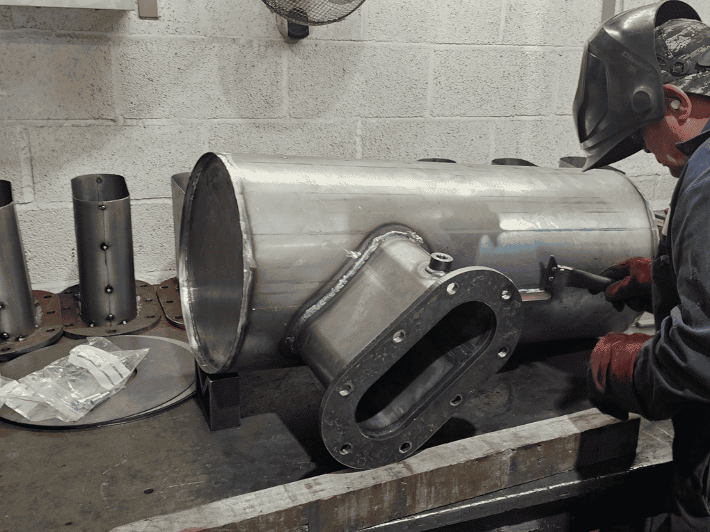 Photo of a welder preparing to weld.