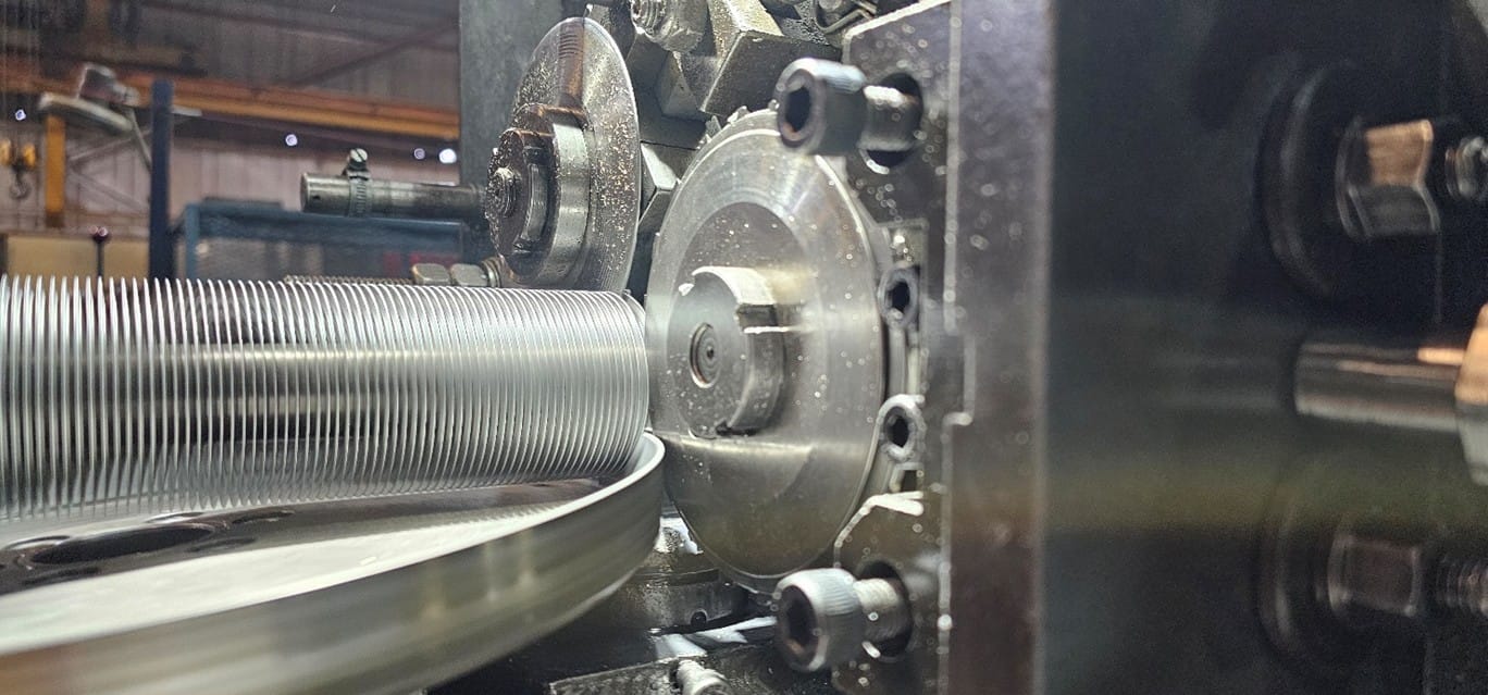 Image of a finning machine finning a tube